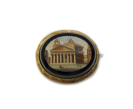 A Victorian gold and micromosaic brooch depicting a Neo-Classical building with figures in the foreground, rub-over set withi