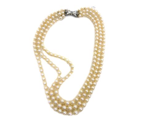 A collection of jewellery, comprising; a three row cultured pearl necklace on a paste bow clasp, the rows of 65, 61 and 58 cu