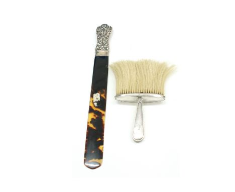 A late Victorian silver mounted tortoiseshell blade page turner, London 1900, the shaped handle embossed with flowers and lea