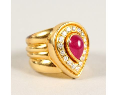 AN 18CT GOLD, CABOCHON RUBY AND DIAMOND HEART SHAPED RING.