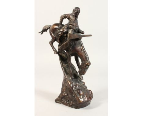 A CAST METAL MODEL, Indian huntsman on horseback. 9.5ins high.