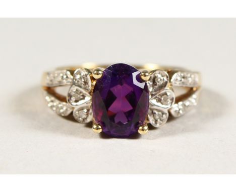 A 9CT GOLD, AMETHYST AND DIAMOND RING.