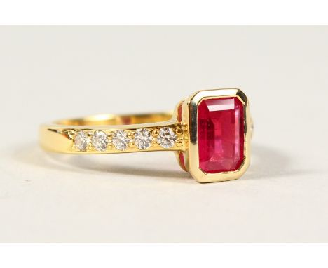 A RUBY AND DIAMOND 18CT GOLD RING.