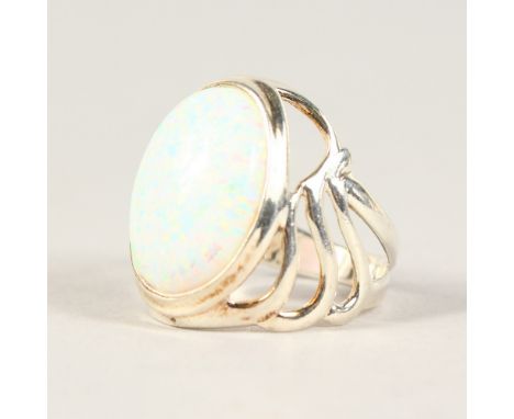 A SILVER AND OPAL RING.