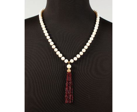 A SILVER GOLD PLATED, RUBY AND PEAR TASSEL NECKLACE.