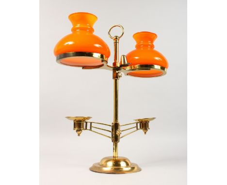 A MODERN BRASS TWO-LIGHT CANDLESTICK, with orange glass shades. 15.5ins high.