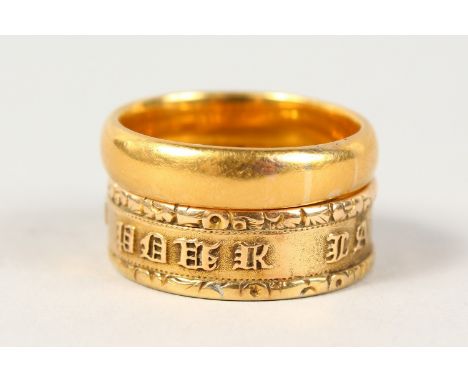 A 22CT GOLD WEDDING BAND, another gold ring with an inscription (2).