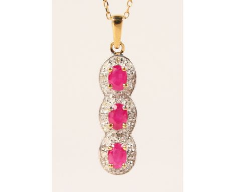 A 9CT GOLD, RUBY AND DIAMOND PENDANT AND CHAIN.