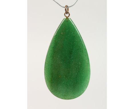 A GREEN JADE TIER DROP PENDANT.