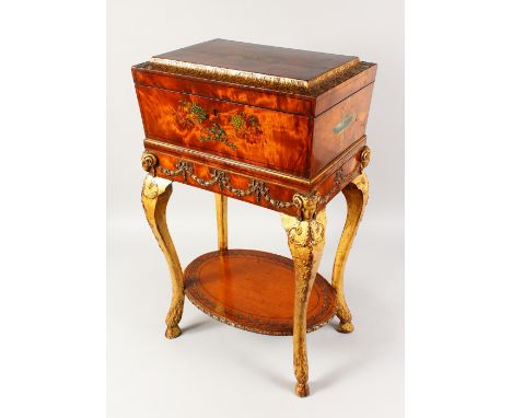A GOOD 19TH CENTURY AND LATER MAHOGANY, PAINTED AND GILDED TEAPOY, with carved and gilded legs, the caddy painted with classi