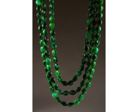 A VERY GOOD TRIPLE ROW JADE NECKLACE, with 18ct gold clasp.