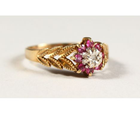 A 9CT GOLD, DIAMOND AND RUBY SET RING.