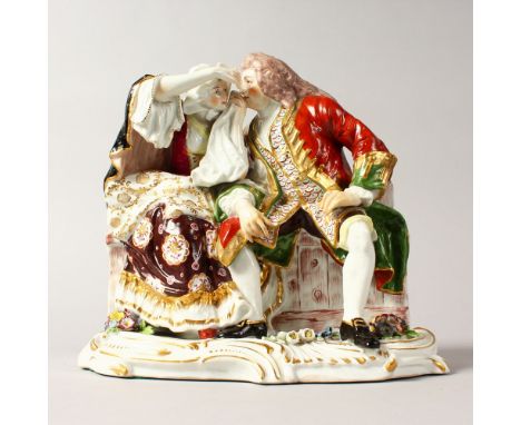 AN 18TH CENTURY STYLE CONTINENTAL PORCELAIN GROUP OF LOVERS ON A RUSTIC  BENCH. 8ins high.