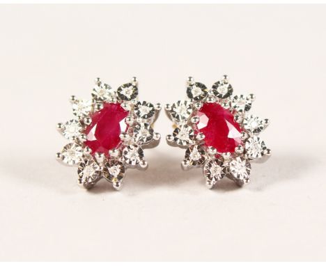 A PAIR OF 9CT GOLD, RUBY AND DIAMOND CLUSTER EARRINGS.