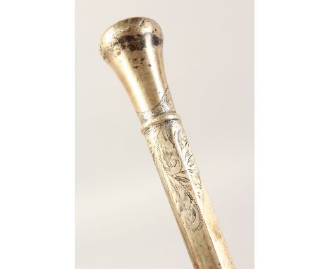 AN ENGRAVED SILVER WALKING STICK HANDLE. 11ins long.