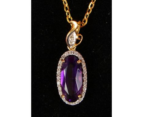AN 18CT YELLOW GOLD SUBSTANTIAL AMETHYST AND DIAMOND PENDANT NECKLACE.