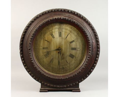 AN UNUSUAL 19TH CENTURY LARGE CIRCULAR WALL/MANTLE CLOCK, the silvered dial engraved with Roman numerals, minutes, months and