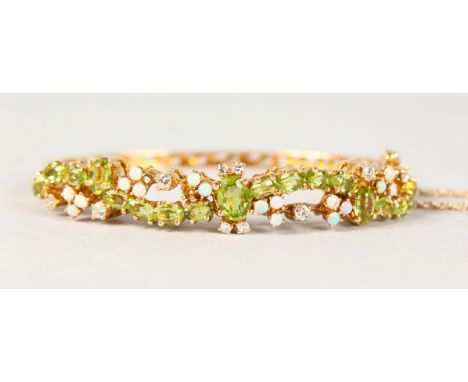 A LOVELY PERIDOT AND OPAL GOLD BRACELET.