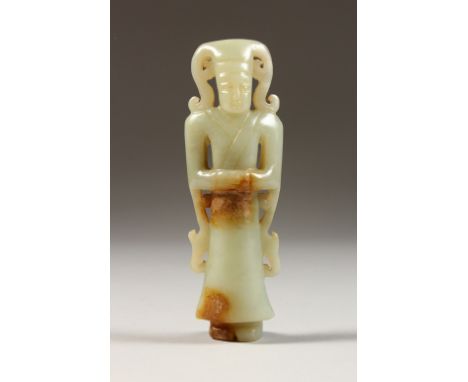 A CHINESE CARVED JADE GOD. 6ins long.