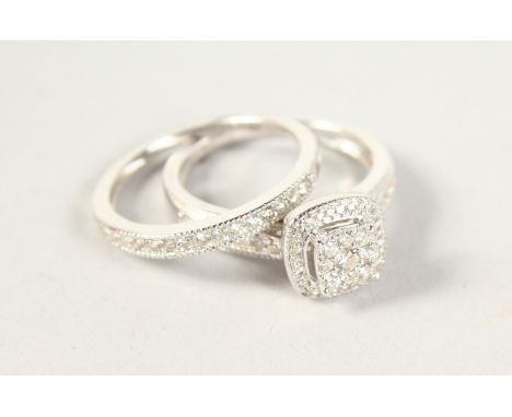 A 9CT GOLD DIAMOND ENGAGEMENT AND WEDDING RING (2).