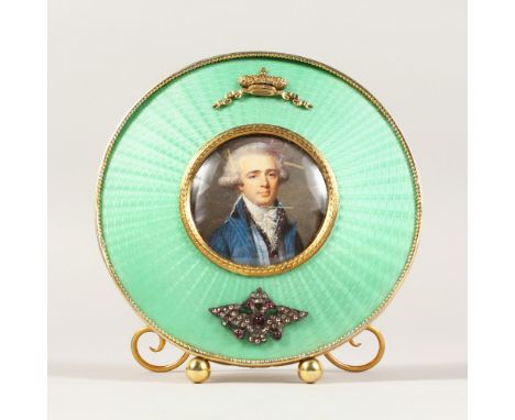 A SUPERB RUSSIAN "FABERGE" STYLE CIRCULAR SILVER GILT AND ENAMEL EASEL MIRROR, 4.75ins diameter, the centre with a portrait.