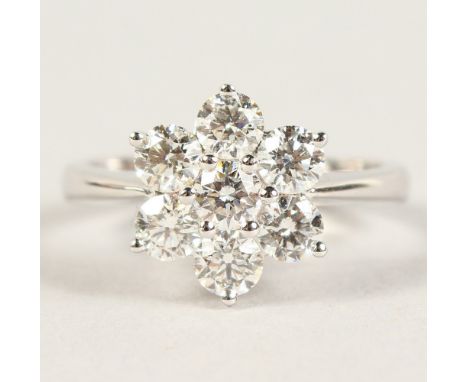 A GOOD 18CT WHITE GOLD DAISY STYLE DIAMOND RING of 1.3cts.