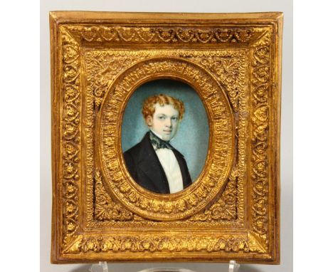 AN OVAL PORTRAIT OF A YOUNG MAN, head and shoulders, oval, in a gilt frame. 3ins x 2ins.