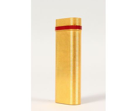 A CARTIER GOLD PLATED GAS LIGHTER, in original red box with paperwork.