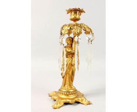A 19TH CENTURY FRENCH SINGLE LIGHT CANDLESTICK, formed as a classical lady holding a light with cut prism drops. 11ins high.