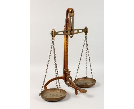 A LARGE SET OF BRASS BALANCE SCALES by DEGRAVE &amp; CO., London. 22ins high.