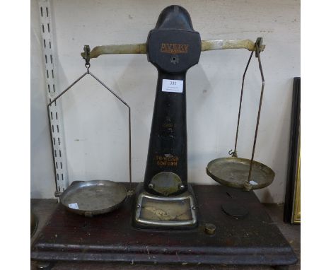 A brass oil lamp and a set of vintage Avery scales 