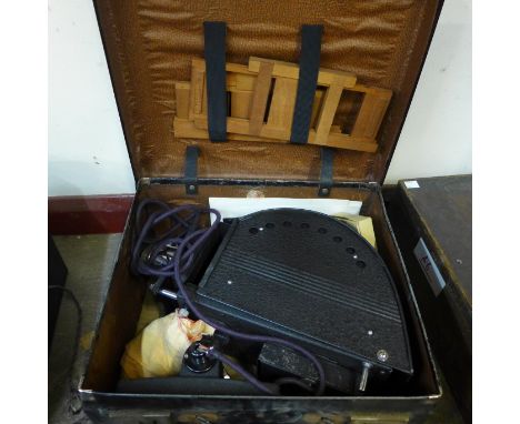 A Johnson Optiscope slide projector in case 