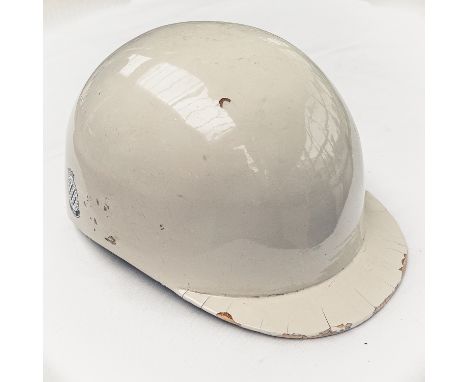Stirling Moss wore only four helmets during his career as a professional racing driver. Two were manufactured by Herbert John