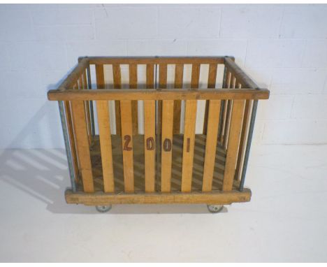 An industrial wooden slatted bobbin trolley - from Axminster Carpets, length 107cm, depth 71cm, height 84cm.