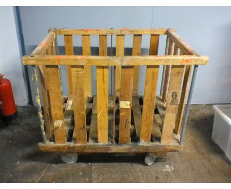 An industrial wooden slatted bobbin trolley - from Axminster Carpets, length 108cm, depth 71cm, height 92cm.