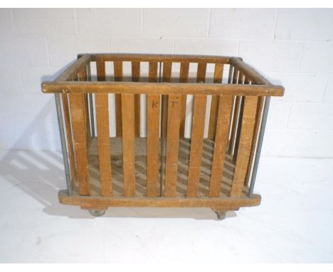 An industrial wooden slatted bobbin trolley - from Axminster Carpets, length 109cm, depth 71cm, height 82cm.