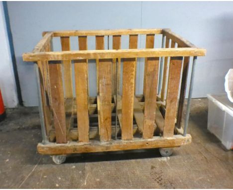 An industrial wooden slatted bobbin trolley - from Axminster Carpets, length 108cm, depth 71cm, height 85cm.