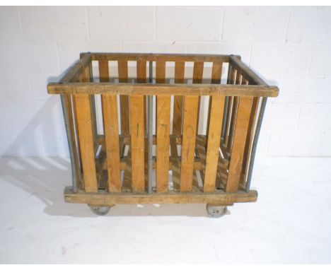An industrial wooden slatted bobbin trolley - from Axminster Carpets, length 107cm, depth 70cm, height 86cm.
