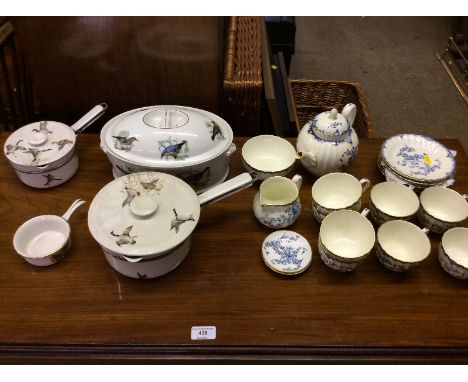 A quantity of Royal Worcester "Mansfield" patterned teaware; and various cooking pots 