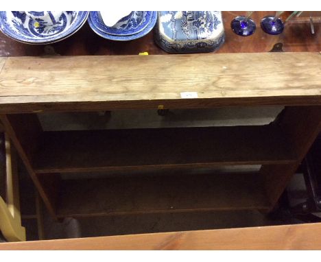 A stripped pine wall shelf