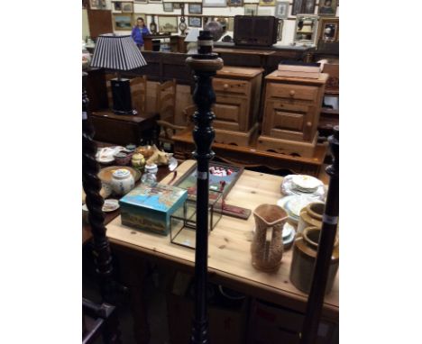 An ebonised standard lamp