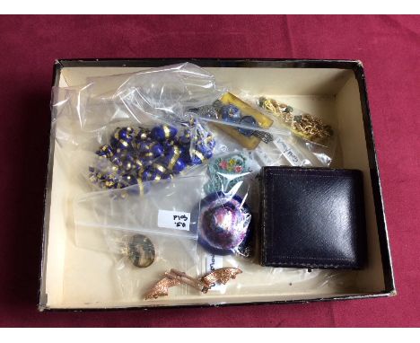 A box of various jewellery to include an Art Deco style brooch; a blue and gilt bead necklace; a yellow metal mounted portrai