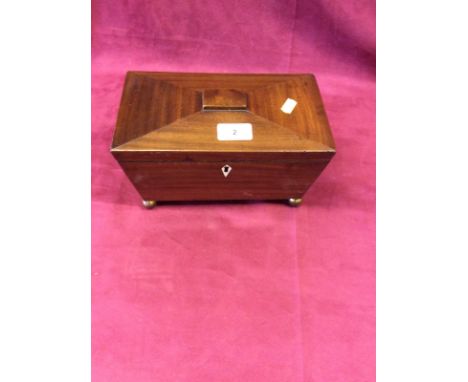 A Victorian mahogany two compartment tea caddy of sarcophagus shape