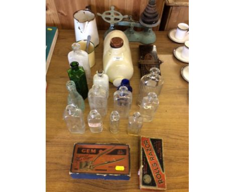 A set of kitchen scales and weights; an enamel jug; a stoneware hot water bottle; various glass bottles etc.