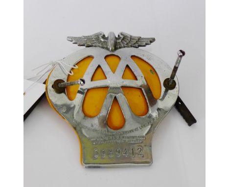 A vintage AA car badge, number 0989412