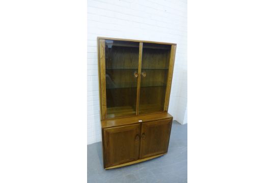 An Ercol Windsor Range Display Cabinet And Base Comprising