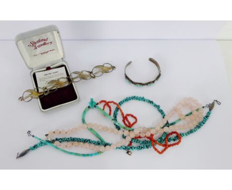A mixed lot to include pink jade beads, coral and turquoise beads, a Scottish silver Arctic Tern bracelet and a turquoise bra