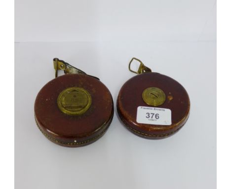 Two vintage leather cased and brass mounted tape measures to include a 10m example, (2) 