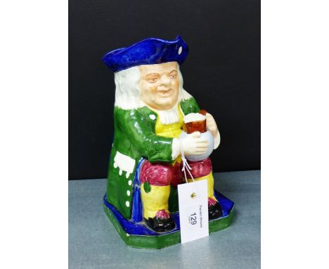 A Copeland Spode Toby jug depicting a seated tavern drinker in green frock coat, blue tricorn hat and with a jug of frothing 