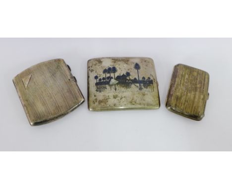 Two early 20th century silver and engine turned cigarette cases together with an Iraqi white metal and neillo work cigarette 